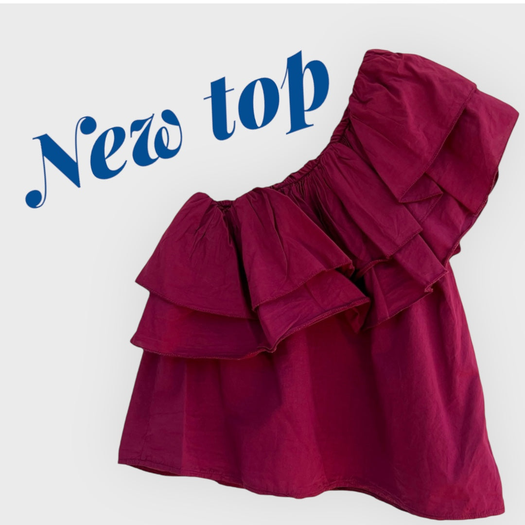 Top asimétrico con volantes